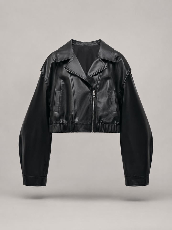 Woman wearing a cropped faux leather biker jacket with notch lapels