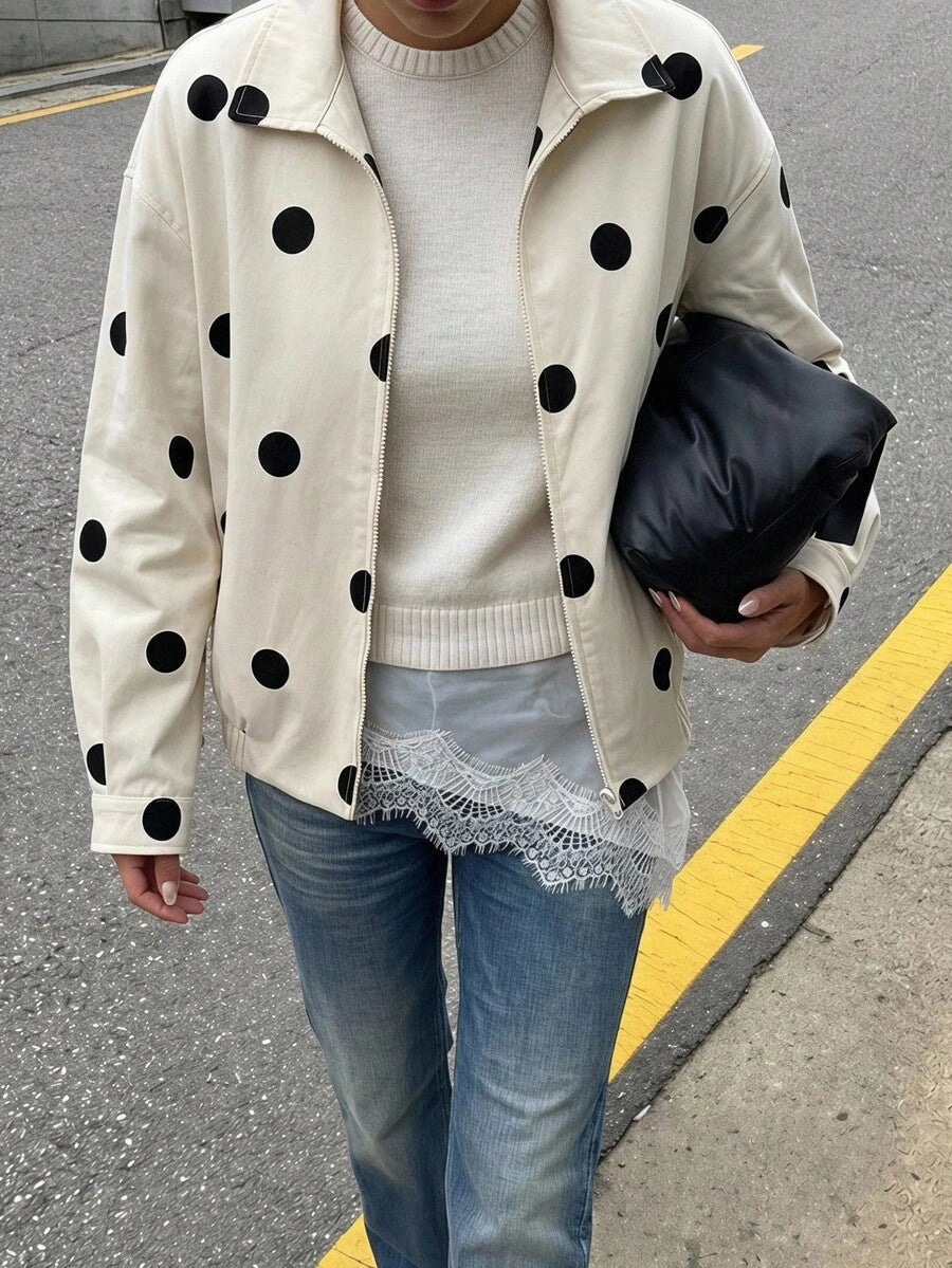 Woman wearing a slouchy oversized faux leather jacket with a dropped shoulder