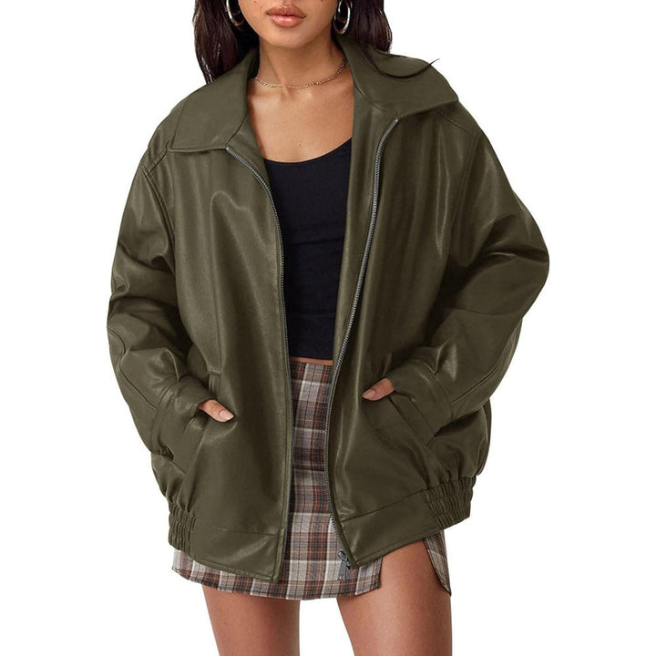 Woman wearing an oversized faux leather bomber jacket with a point collar