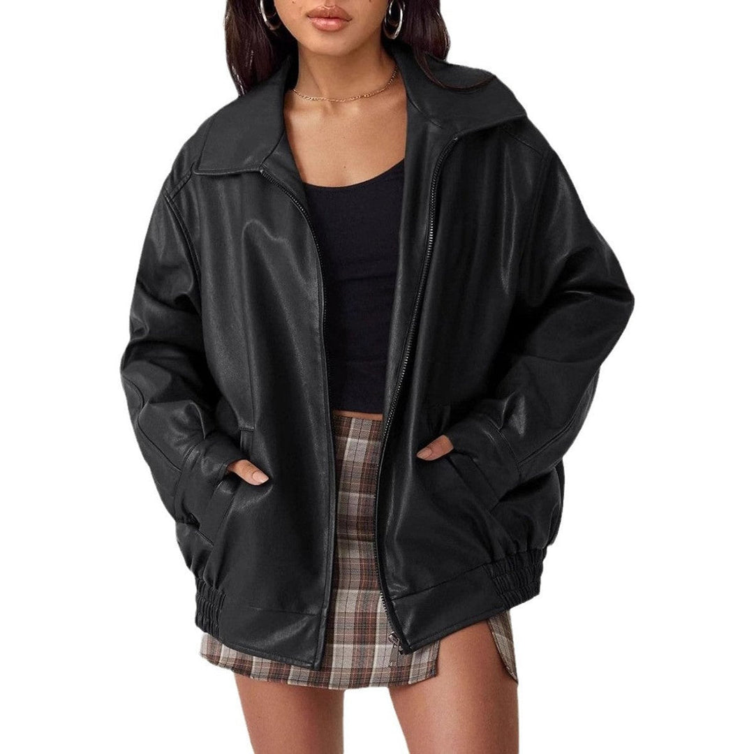 Woman wearing an oversized faux leather bomber jacket with a point collar