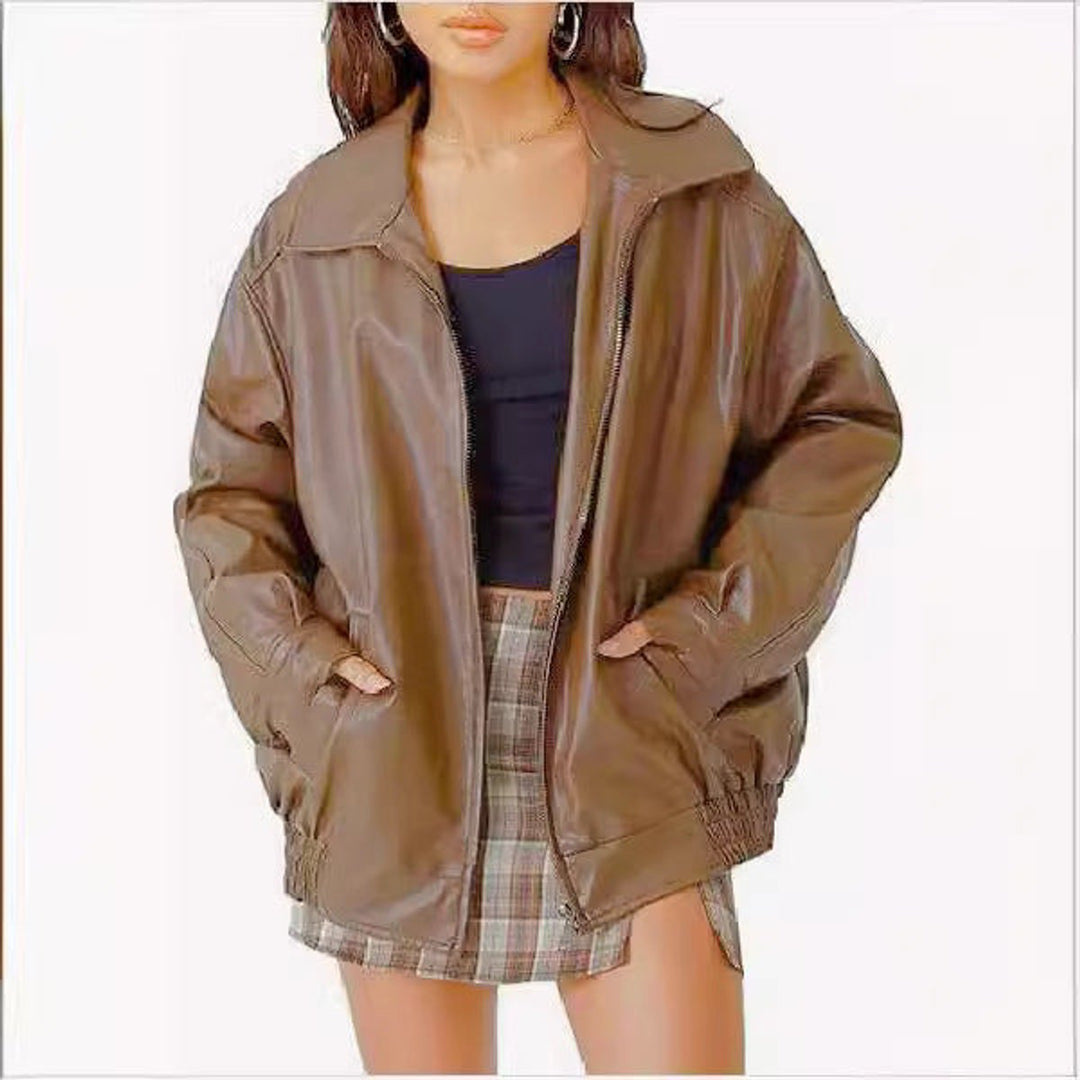 Woman wearing an oversized faux leather bomber jacket with a point collar